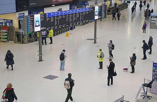 Passengers currently have to watch departure boards to find out what platform their train will depart from (pictured: Waterloo station in London)