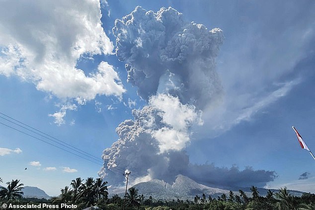 In photo released by Geological Agency (Badan Geologi) of the Indonesia's Ministry of Energy and Mineral Resources, Mount Lewotobi Laki-Laki spews volcanic materials during an eruption in East Flores, Indonesia, Monday, July 7, 2025