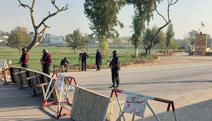 Security personnel stand guard on a road leading to the cantonment area in Bannu, December 20, 2022. — Reuters/File