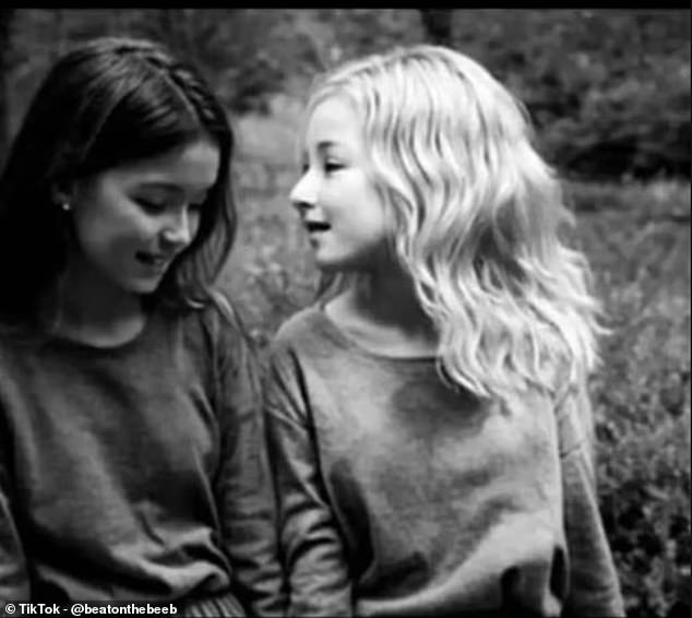 This might look like a photo of two girls, but there is a third face hidden in the image that only one in 10 people will be able to see when looking at it at their phone