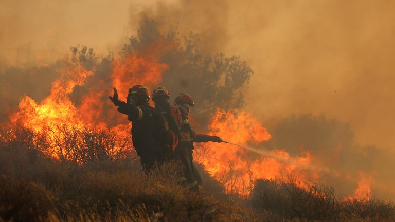 Firefighters try to extinguish a wildfire near Lerapetra, on the island of Crete, Greece.
Pic: Reuters