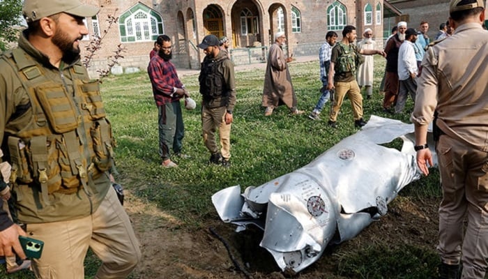 Metal debris lies on the ground in Wuyan in Indian Illegally Occupied Jammu & Kashmirs Pulwama district district May 7, 2025. —Reuters