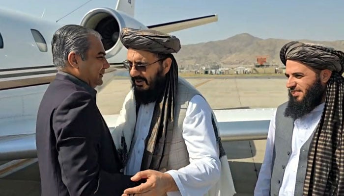 Afghan Interim Deputy Interior Minister Mohammad Nabi Omari receives Interior Minister Mohsin Naqvi on his arrival at Kabul airport, Afghanistan, July 20, 2025. — State media