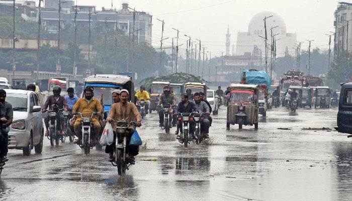 Motorists on their way after the heavy rainfall in Karachi on June 27, 2025. — Onlin