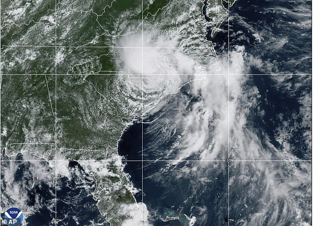 Millions of Americans are under flood alerts a storm moves northward along the East Coast, bringing heavy rain, dangerous surf and widespread power outages
