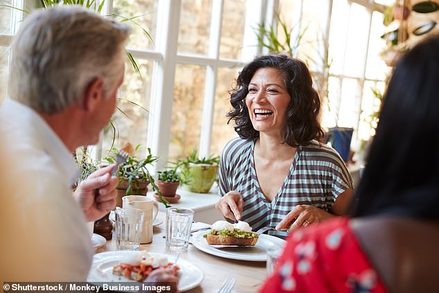 Listening to laughter, admiring a flower on a neighbourhood walk or doing a nice thing for a friend can measurably improve people's emotional wellbeing (stock image)