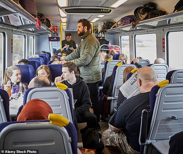 The future of train travel could look remarkably different to today's carriages, where passengers sit close together and sometimes have to stand (file image)