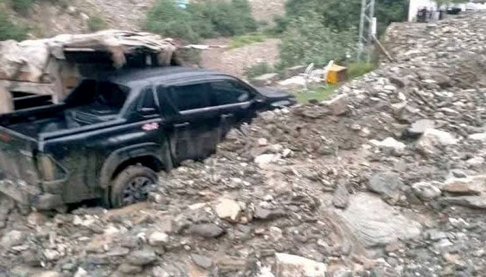 A vehicle caught in a landslide in Chilas. — Screengrab via GeoNews