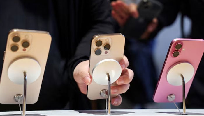 A man checks an iPhone 16 Pro at an Apple store in Beijing, China on September 20, 2024. — Reuters