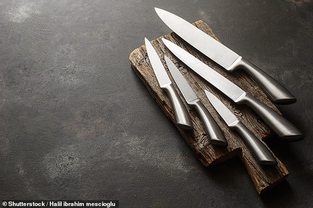 Putting proper kitchen knives in the dishwasher can make them dull. Experts recommend washing them by hand to avoid having to sharpen them more often (stock image)