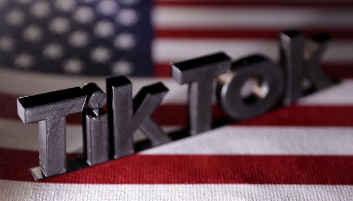 TikTok logo is placed on a US flag in this illustration taken on April 25, 2024. — Reuters