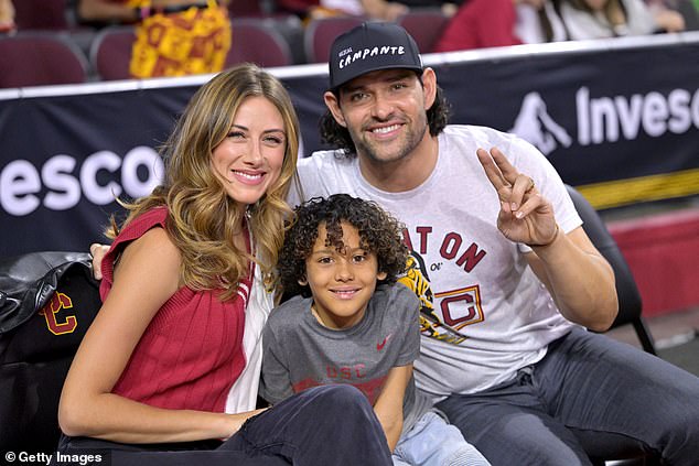 The ex-NFL star, pictured with wife Hollywood-star wife Perry Mattfeld and son Daniel in January 2024, was in Indianapolis to work for Fox Sports