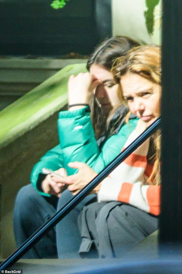 In another seemingly tense moment, Suri ¿ whom Katie shares with ex-husband Tom Cruise, 63 ¿ was seen clutching her face with her hand