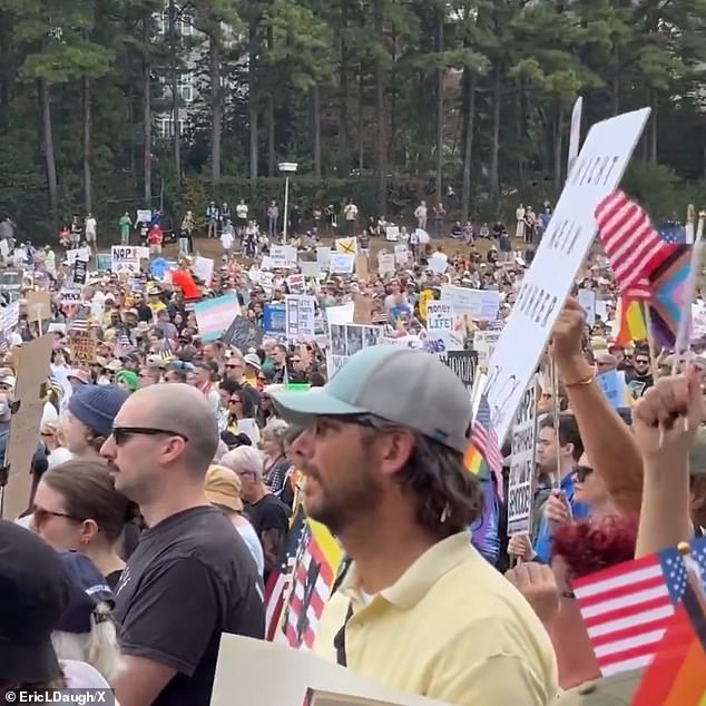 Demonstrators in Atlanta appear to be predominantly white, many waving transgender flags
