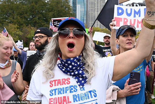A grey-haired woman demonstrating against Trump in Chicago on Saturday