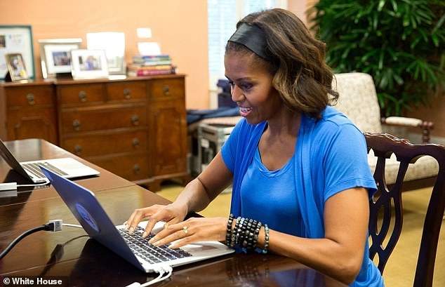 First Lady Michelle Obama participates in a Twitter chat to discuss school nutrition and the White House Kitchen Garden, in the First Lady's Office in the East Wing of the White House, June 12, 2014