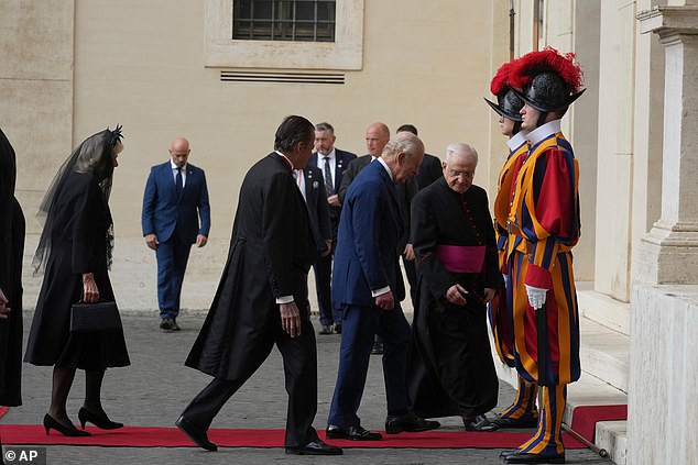 King Charles III and Queen Camilla are welcomed by officials at San Damaso Courtyard today