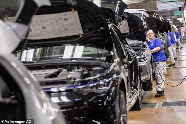 On Wednesday, Volkswagen told workers at other plants in Germany t hat it cannot rule out assembly line stoppages due to the 'dynamic situation'. Wolfsburg Golf assembly line pictured