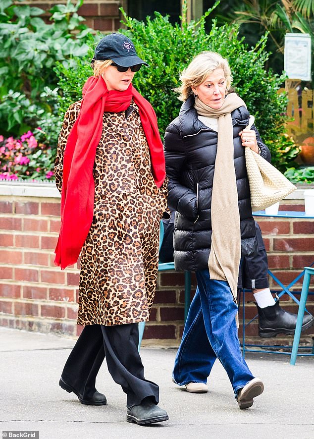 The 35-year-old Oscar winner's attempt at dressing incognito around family failed as she couldn't help but stand out wearing a bright red scarf around her leopard-print coat