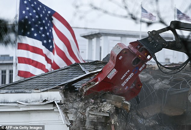 Heavy machinery tears down a section of the East Wing of the White House as construction begins on President Donald Trump's planned ballroom, in Washington, DC, on Wednesday