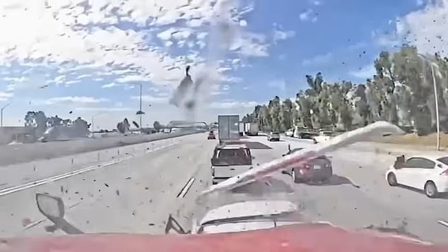 The terrifying video showed the semi-truck smashing into the back of a white SUV, before causing another car and a red sedan