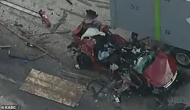 The sedan erupted into a fireball as it was pushed into another semi-truck