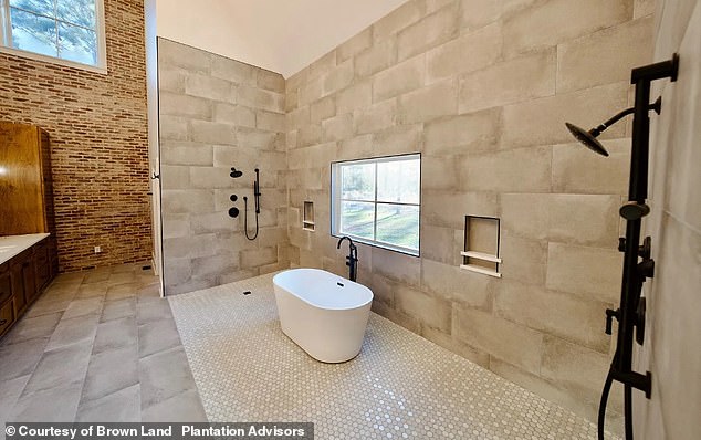 The expansive property features five bathrooms, with its master bathroom being described as 'spa-like' in the listing