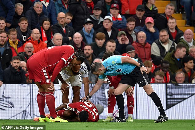 Ryan Gravenberch lies on the floor in pain during Liverpool's loss to Manchester United at Anfield... but he should be back for the weekend