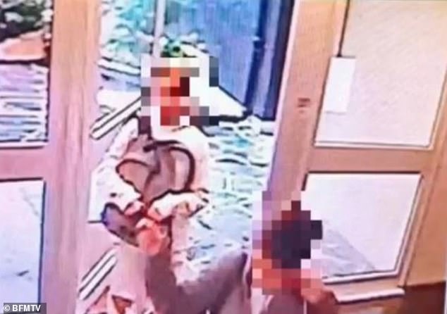 Lola is pictured in this CCTV footage still wearing a white coat and carrying what appears to be her schoolbag, as she follows a female suspect, believe to be Benkired, into an apartment building