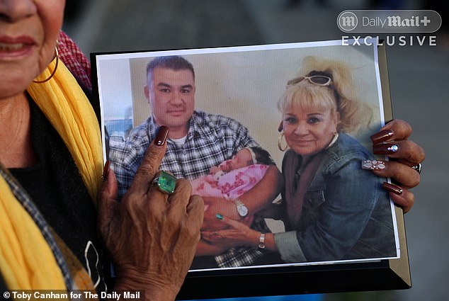 Denes led a candle lit vigil outside of Melodee's home in Lompoc, California. She told the Daily Mail she only found out she was missing when CPS called for information (Pictured: Denes holding a photo of baby Melodee, her deceased son and herself)