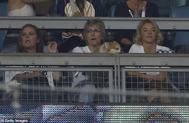 She wore rectangular Prada sunglasses and a dainty, diamond tennis necklace for her effortlessly chic game-time look