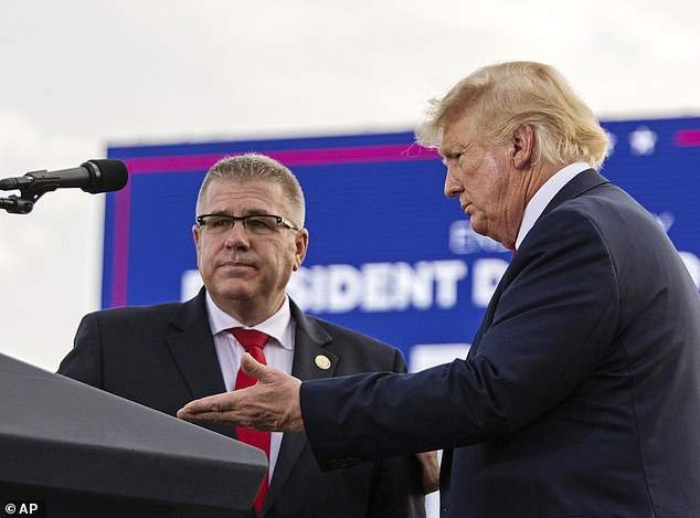 Bailey is seen here alongside Donald Trump at a rally in Illinois in June of 2022