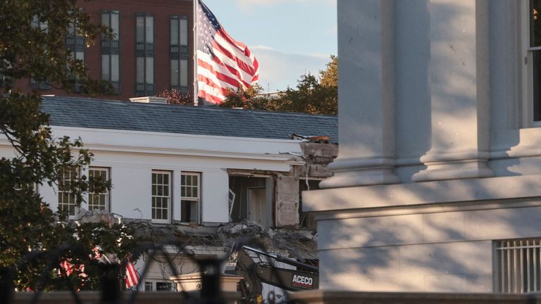Windows of the complex could be seen being torn down. Pic: Reuters