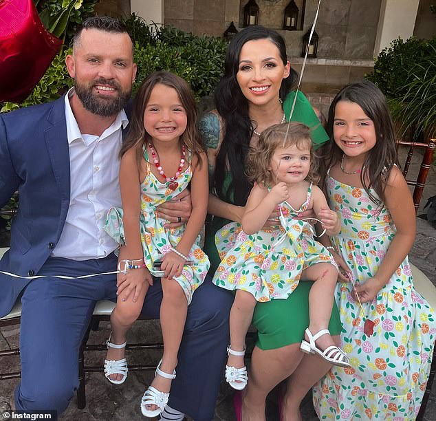 Christopher Scholtes is said to have been watching porn while his two-year-old daughter Parker (pictured above being held by her mother Erika) died in a hot car