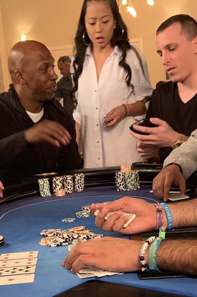DailyMail.com has obtained a picture showing Chauncey Billups (left) at a poker table in 2019 alongside two alleged co-conspirators; Sophia Wei (middle) and Saul Becher (behind Wei)