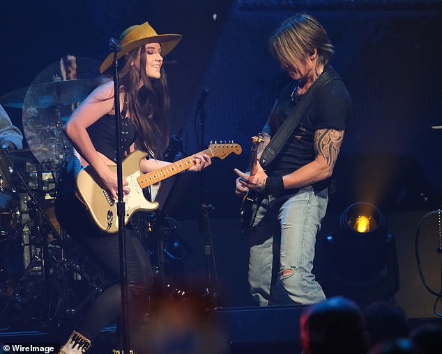 Keith Urban, 57, shockingly pointed to guitarist Maggie Baugh, 25, and sang 'I was born to love you' while performing The Fighter in an unearthed clip from an April 1 concert in Las Vegas (pictured on stage in 2024)