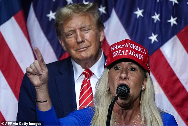 Representative Marjorie Taylor Greene (R) speaks alongside Trump at a campaign event in Rome, Georgia, on March 9, 2024