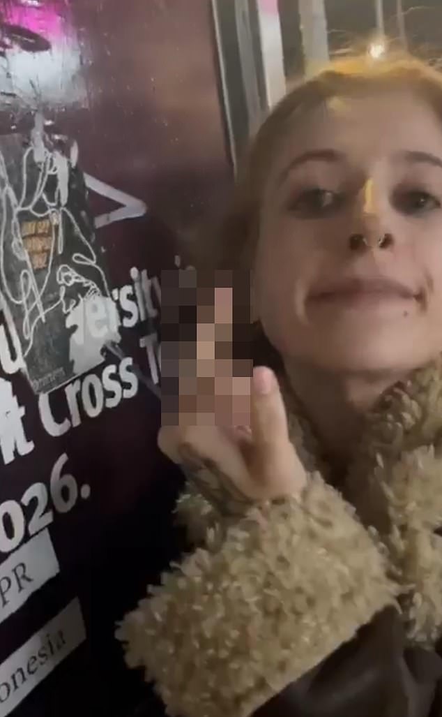A pro-Palestinian supporter has been accused of 'pure visceral hatred' after she was filmed repeatedly spitting on a poster calling for the release of Israeli hostages in north London