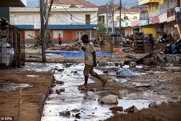 At least 19 individuals in Jamaica and 30 people in Haiti have died due to Hurricane Melissa as of Friday afternoon, according to local officials (Pictured: Devastation on the streets in Santa Cruz, Jamaica)
