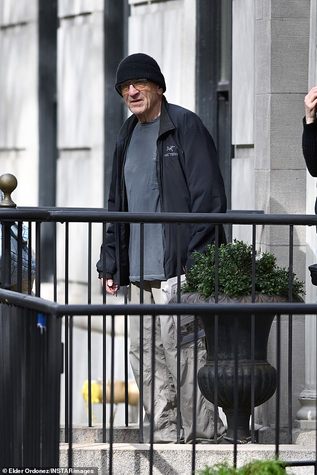 The two-time Academy Award winner, 82, was clad in a casual ensemble of a dark gray coat with a light gray shirt and light khaki sweats as he exited a Big Apple building on Friday