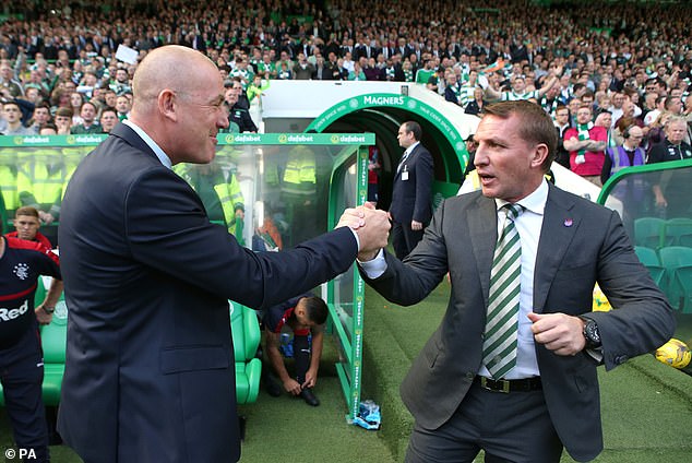 Warburton shakes hands with Celtic boss Rodgers ahead of the 2016 clash at Parkhead