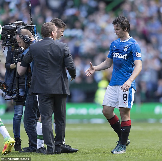 Barton shakes hands with Brendan Rodgers at full time