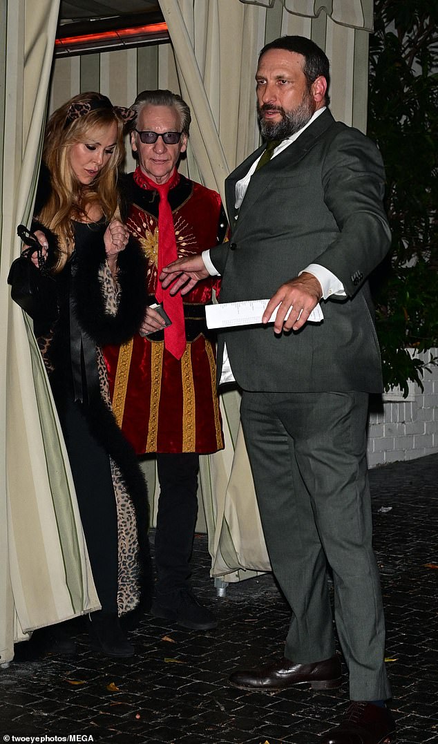 Meanwhile the political talk show host wore an ornate costume resembling a circus ringmaster