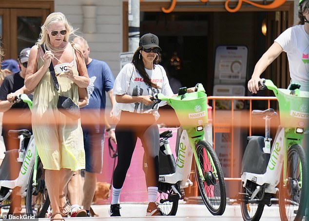 The actress appeared completely at ease as she pedalled through the streets, with her long brunette locks flowing freely beneath her cap