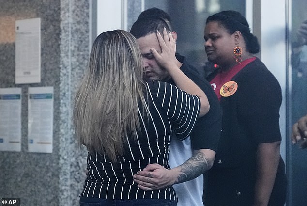Abrego Garcia is seen hugging his wife Jennifer Vasquez Sura at the ICE office in Baltimore