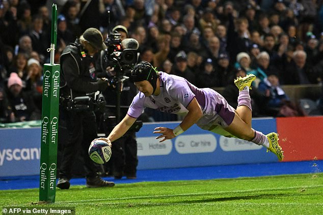 Scotland's wing Darcy Graham dives over the line to score a try at Murrayfield