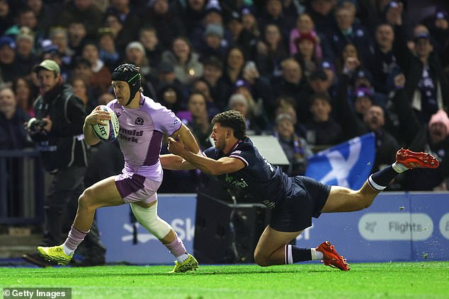Scotland winger Darcy Graham breaks through to score his team's third try