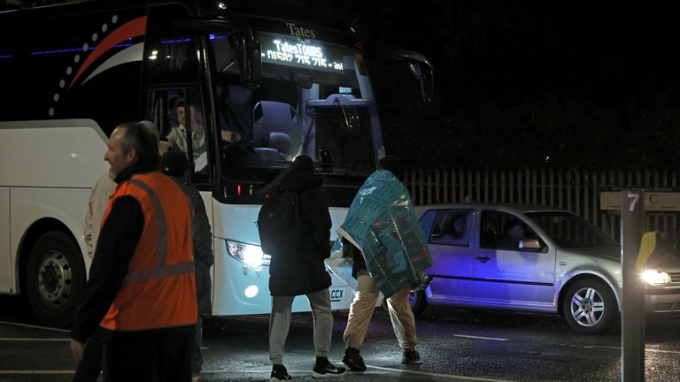 One passenger in an emergency mediwrap blanket walks to safety. Pic: PA