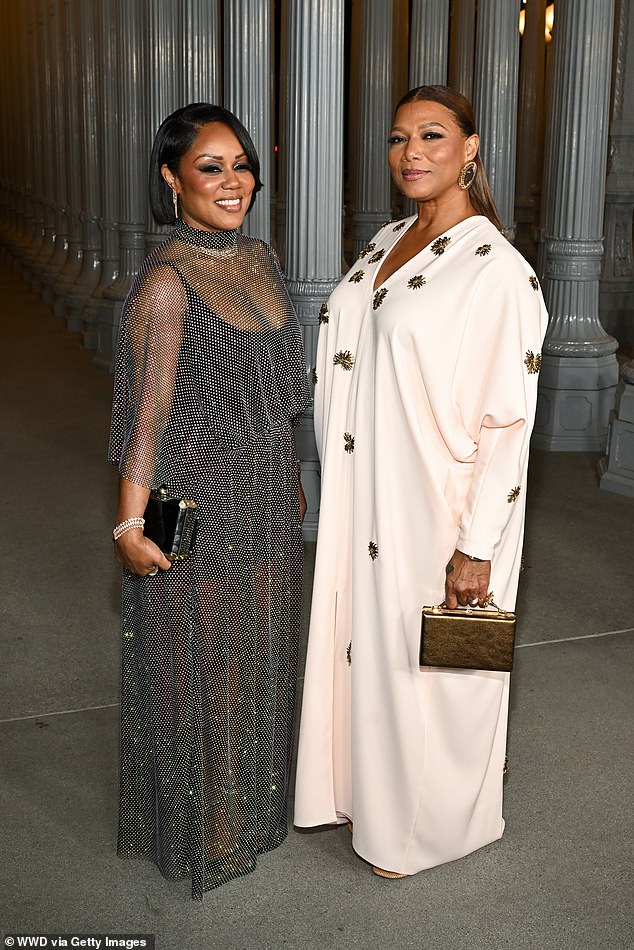 She was joined by her longtime partner Eboni Nichols, who wore a stunning gray mesh dress over a black bodysuit