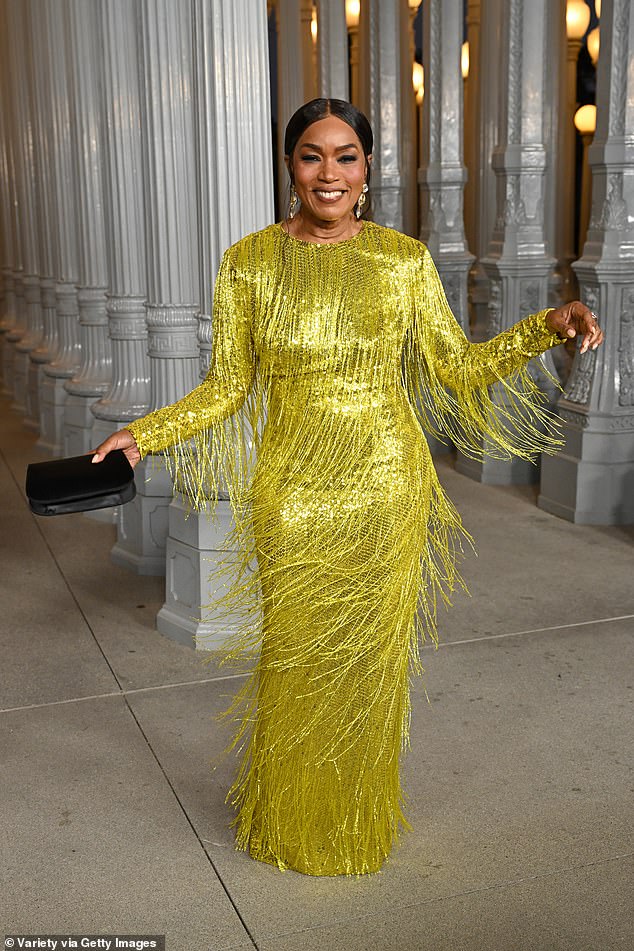 Angela Bassett channeled flapper style with a golden gown decorated with long dangling tassels